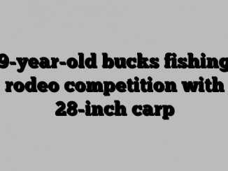 9-year-old bucks fishing rodeo competition with 28-inch carp